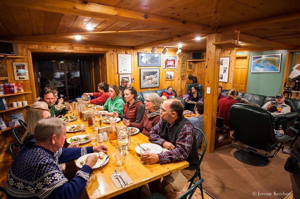 Large group eating together in their cabin